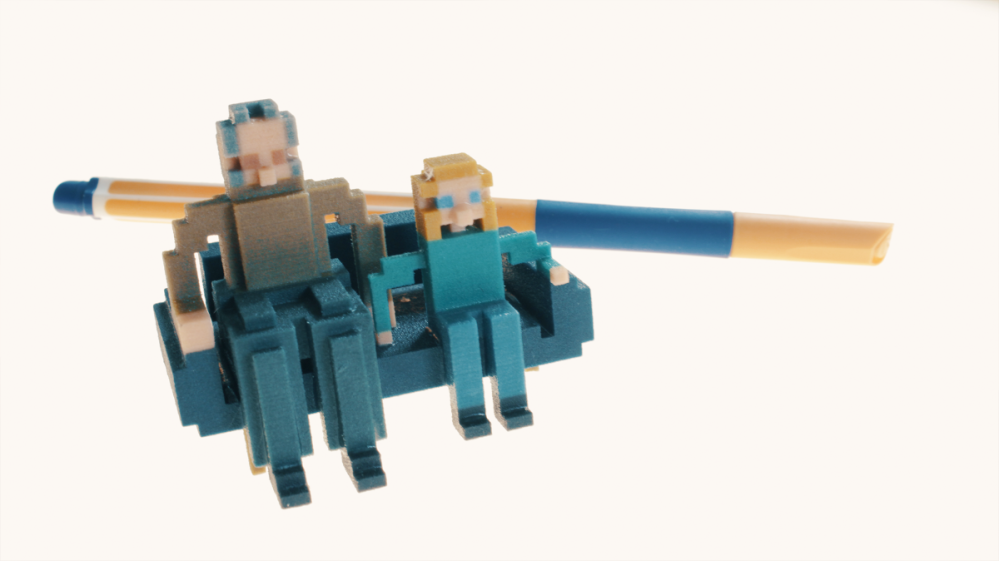 Eye Build It Creator_3D-Print People 3D Druck von zwei Figuren auf einem Sofa, Figuren und Sofa wurden mit dem Eye build It Creator erstellt.